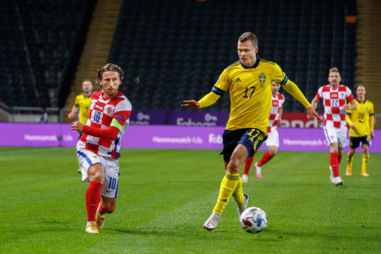 Luka Modric of Croatia and Viktor Claesson of Sweden