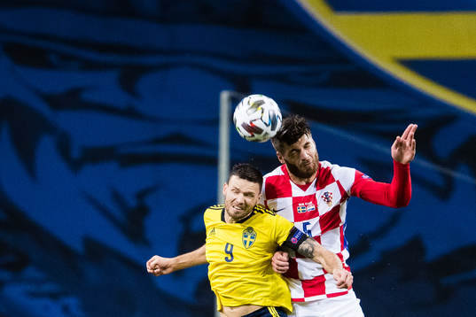 Marcus Berg of Sweden and Duje Caleta-Car of Croatia