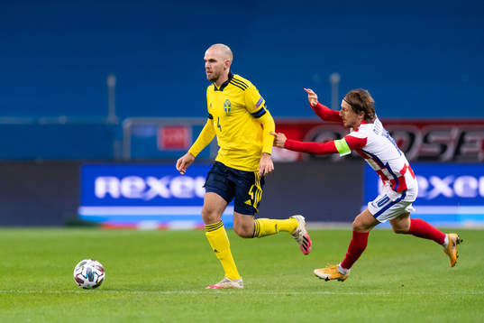 Marcus Danielson of Sweden and Luka Modric of Croatia