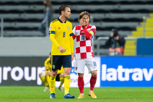 Albin Ekdal of Sweden and Luka Modric of Croatia