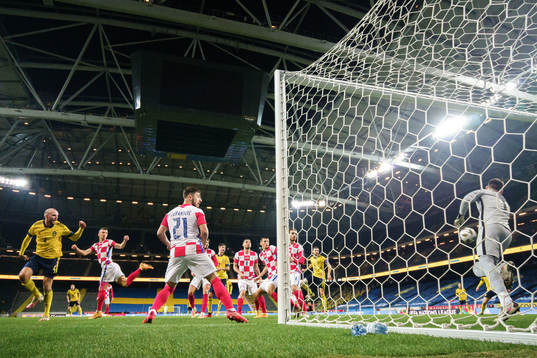 Marcus Danielson of Sweden scores the 2-0 goal behind