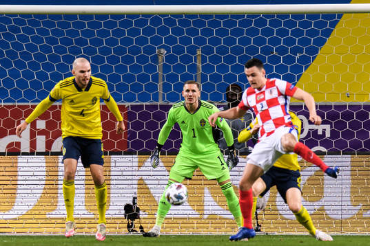 Marcus Danielson and goalkeeper Robin Olsen of Sweden