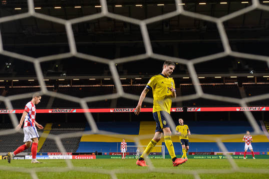 Mikael Lustig of Sweden looks dejected