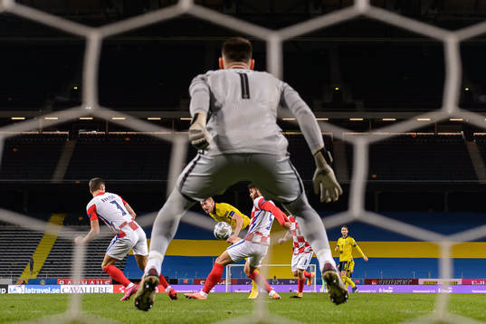 Dejan Kulusevski of Sweden against Duje Caleta-Car and