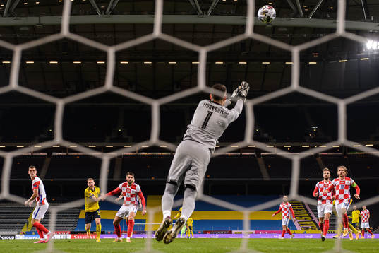 Dejan Kulusevski of Sweden against Duje Caleta-Car and