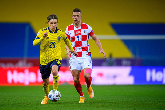 Kristoffer Olsson of Sweden and Ivan Perisic of Croatia