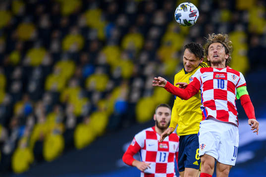 Albin Ekdal of Sweden and Luka Modric of Croatia