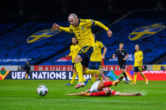 Kristoffer Olsson of Sweden and Ivan Perisic of Croatia