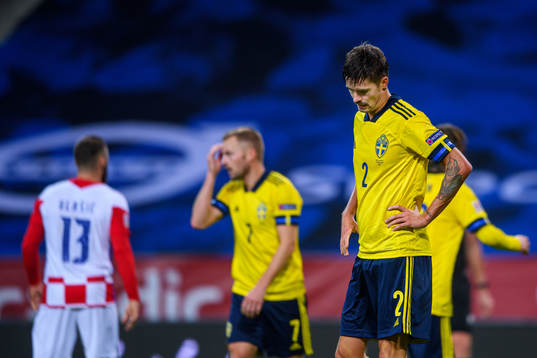 Mikael Lustig of Sweden looks dejected