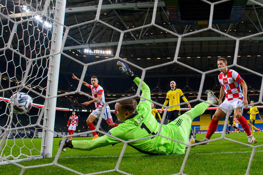 Ivan Perisic of Croatia scores the 2-1 goal behind
