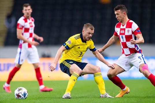 Sebastian Larsson of Sweden and Ivan Perisic of Croatia