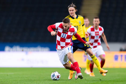 Nikola Vlasic of Croatia and Kristoffer Olsson of Sweden