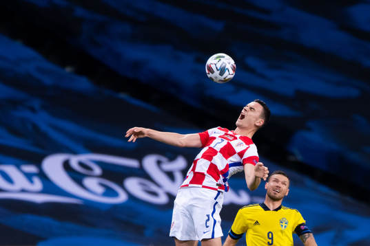 Filip Uremovic of Croatia and Marcus Berg of Sweden