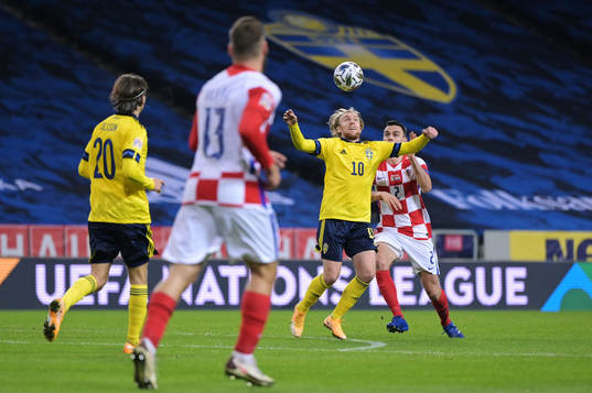 Emil Forsberg of Sweden and Filip Uremovic of Croatia