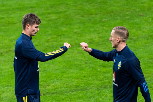 Mikael Lustig and goalkeeper Robin Olsen of Sweden