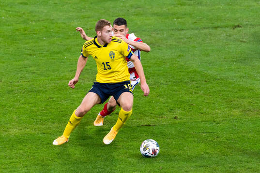 Dejan Kulusevski of Sweden and Ivan Perisic of Croatia