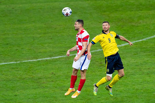Mateo Kovacic of Croatia and Marcus Berg of Sweden