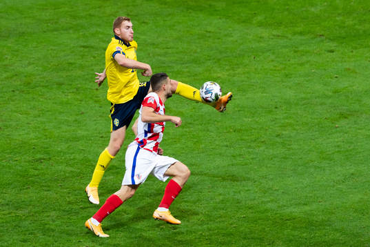 Dejan Kulusevski of Sweden and Mateo Kovacic of Croatia