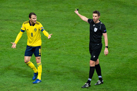 Albin Ekdal of Sweden reacts to referee Daniel Siebert