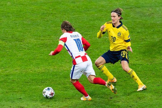 Luka Modric of Croatia and Kristoffer Olsson of Sweden