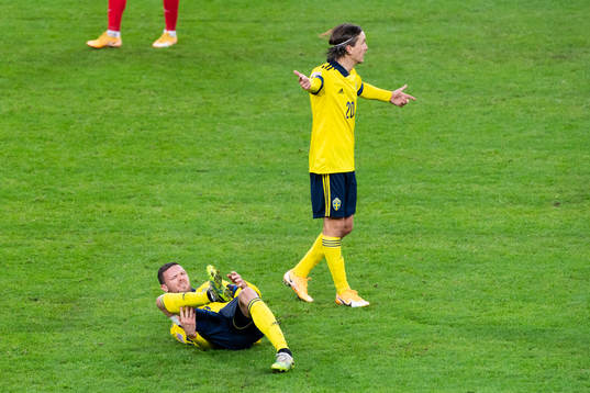 Marcus Berg and Kristoffer Olsson of Sweden reacts