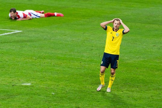 Sebastian Larsson of Sweden looks dejected