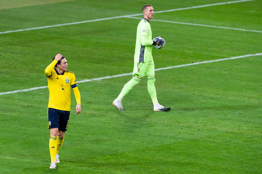 Victor Nilsson Lindelöf and goalkeeper Robin Olsen of