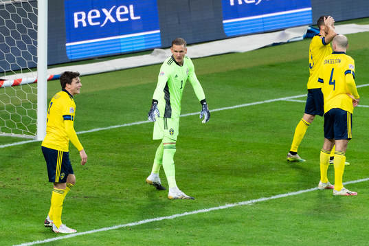 Victor Nilsson Lindelöf and goalkeeper Robin Olsen of