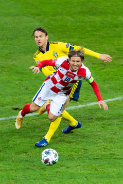 Albin Ekdal of Sweden and Luka Modric of Croatia