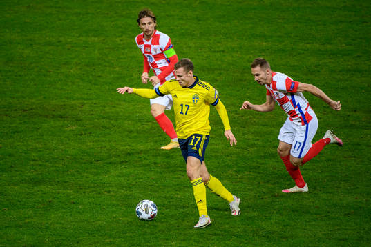 Viktor Claesson of Sweden against Luka Modric and Marko Rog