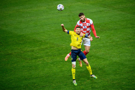 Marcus Berg of Sweden and Duje Caleta-Car of Croatia
