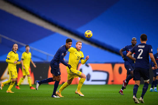 Raphael Varane of France and Dejan Kulusevski of Sweden