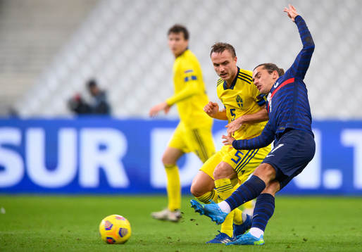 Pierre Bengtsson of Sweden and Antoine Griezmann of France