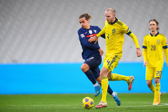 Antoine Griezmann of France and Marcus Danielson of Sweden