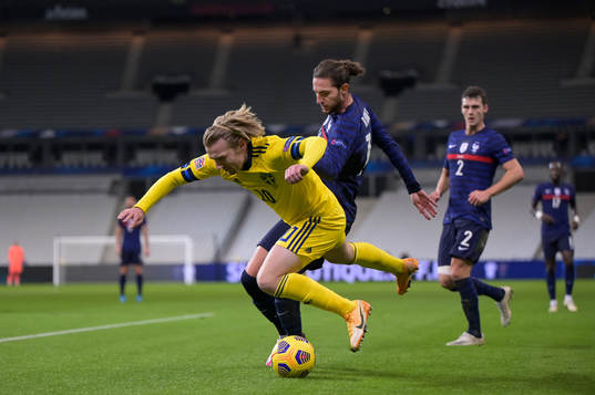 Emil Forsberg of Sweden and Adrien Rabiot of France