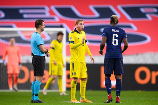 Dejan Kulusevski of Sweden and Paul Pogba of France
