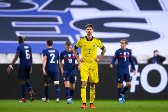 Mikael Lustig of Sweden looks dejected