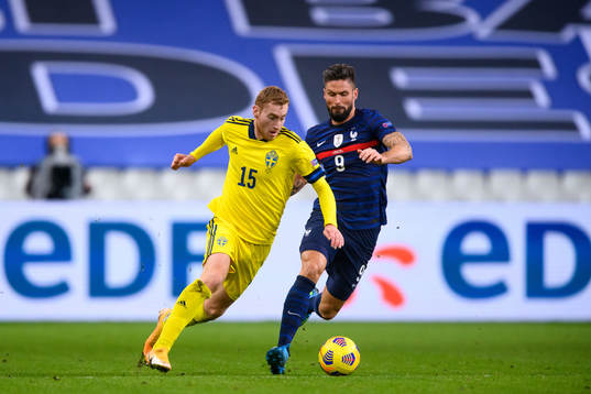 Dejan Kulusevski of Sweden and Olivier Giroud of France