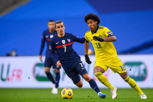 Antoine Griezmann of France and Jens-Lys Cajuste of Sweden