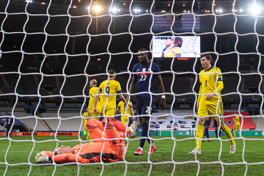 Goalkeeper Robin Olsen of Sweden, Marcus Thuram of France