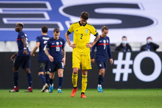 Mikael Lustig of Sweden looks dejected