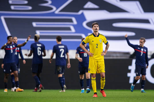 Mikael Lustig of Sweden looks dejected