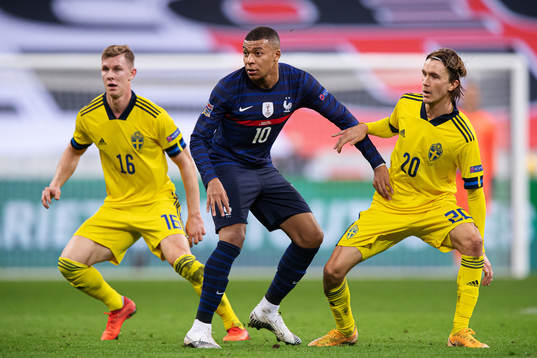 Emil Krafth and Kristoffer Olsson of Sweden and Kylian