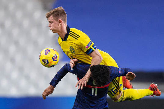 Emil Krafth of Sweden in action against Kingsley Coman of