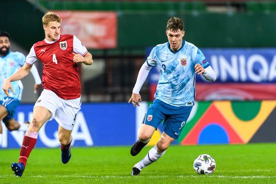 Martin Hinteregger of Austria and Jørgen Strand Larsen of