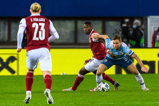 David Alaba of Austria and Sondre Tronstad of Norway