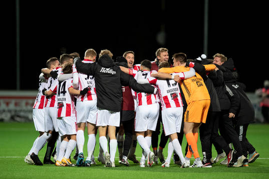 Players of Tromsø celebrate