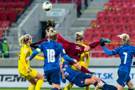 Andrea Horváthová and goalkeeper 12 Maria Korenčiová of