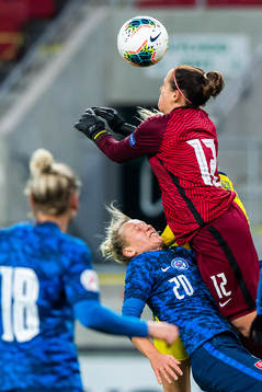 Andrea Horváthová and goalkeeper 12 Maria Korenčiová of