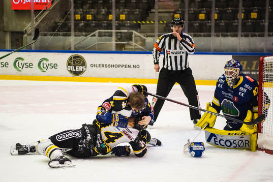 Sondre Bjerke of Storhamar and Brady Maurice Brassart of
